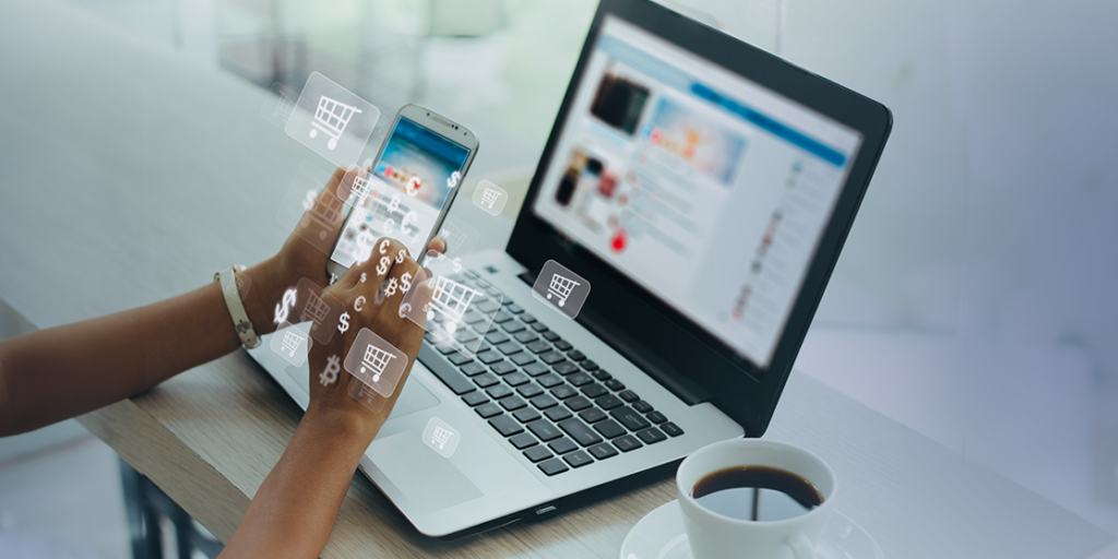 Person shopping online using smartphone with digital cart icons floating around.